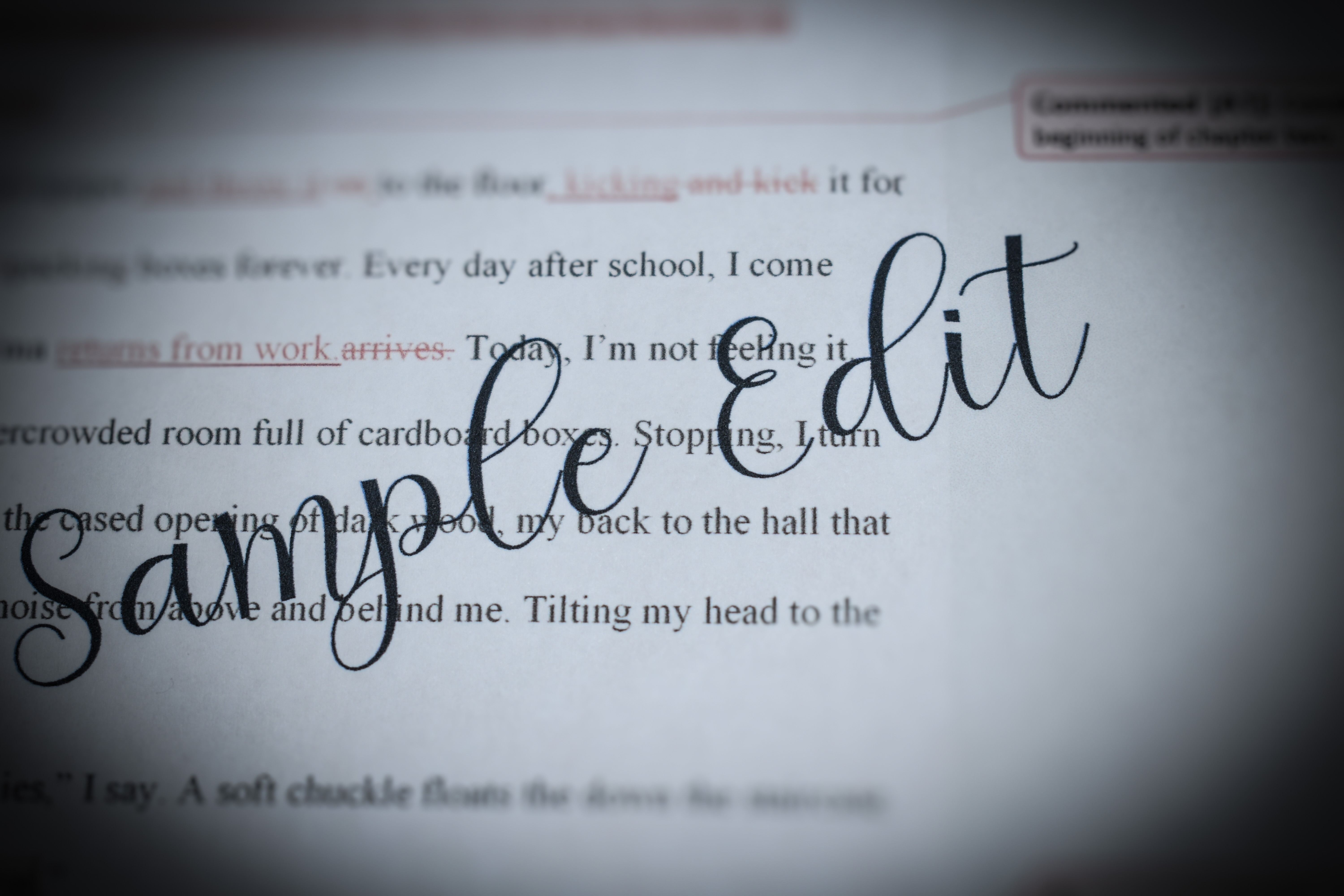 Decorative: Sample edit in script over a typed document.